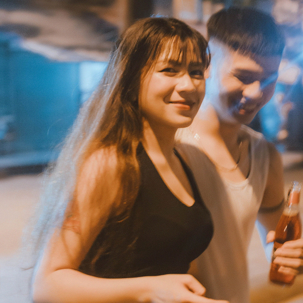 Two friends talking over drinks